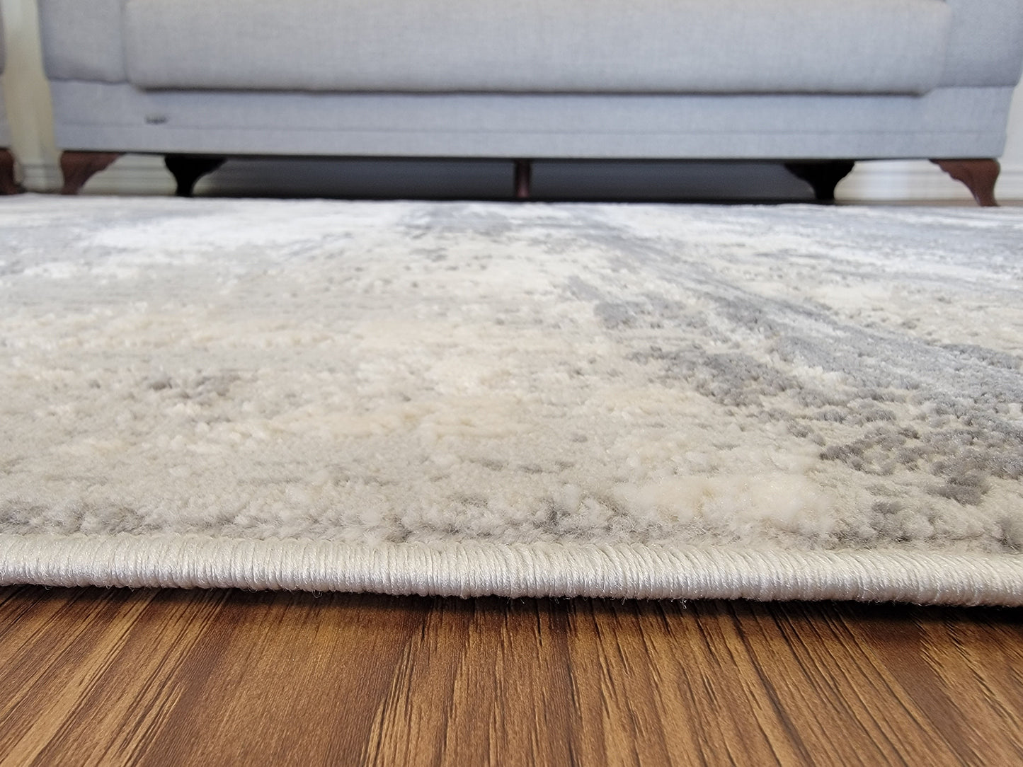 Cozy Abstract Area Rug. Cream, Light Gray, and Slate Gray