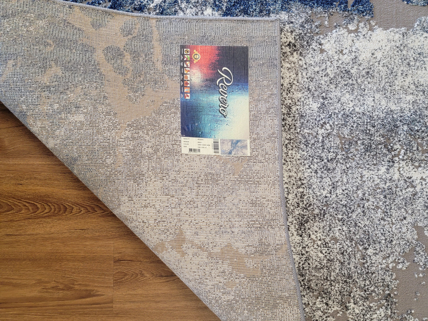 Revero Abstract Area Rug. Ivory, Cobalt Blue, and Gray