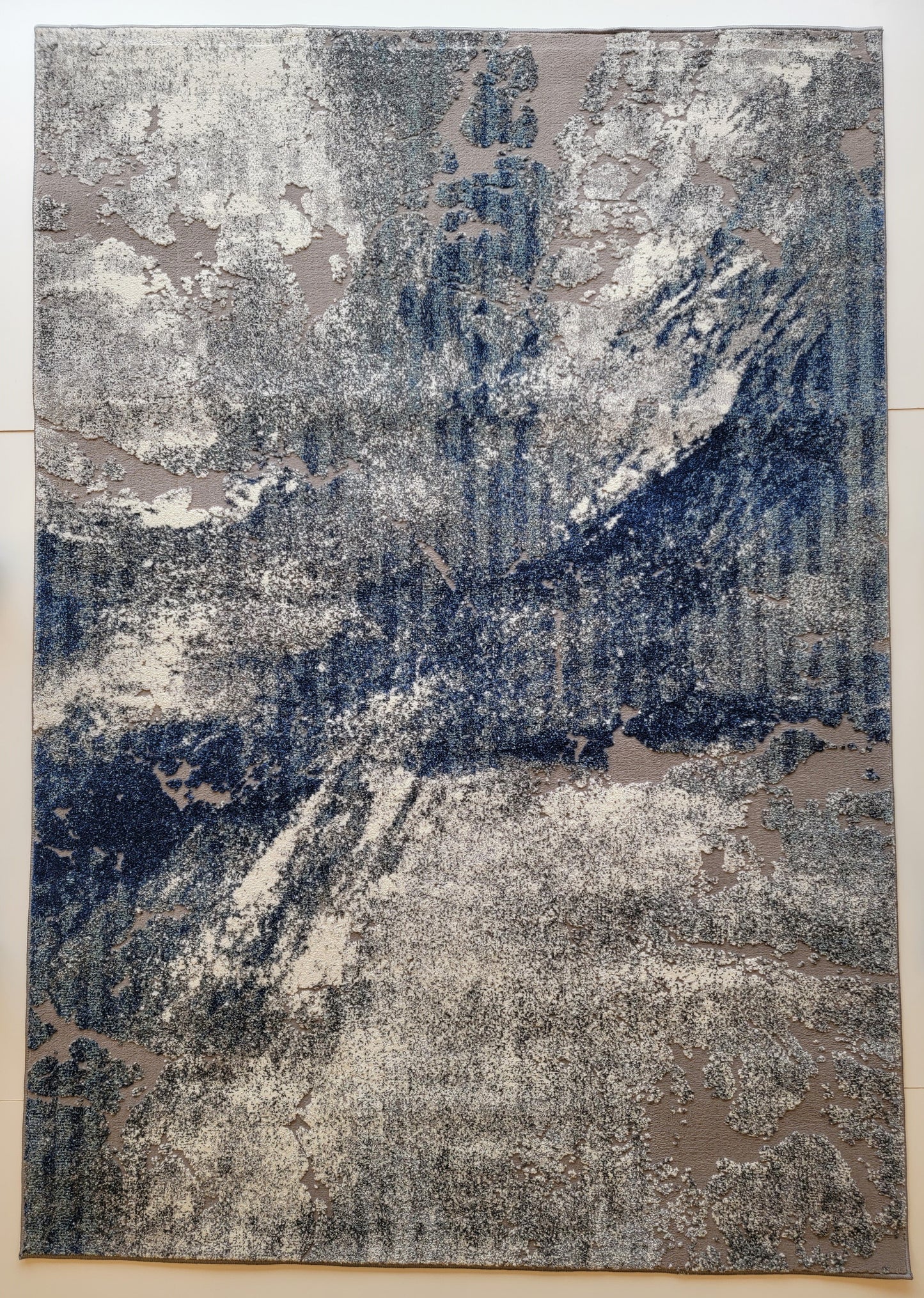 Revero Abstract Area Rug. Ivory, Cobalt Blue, and Gray