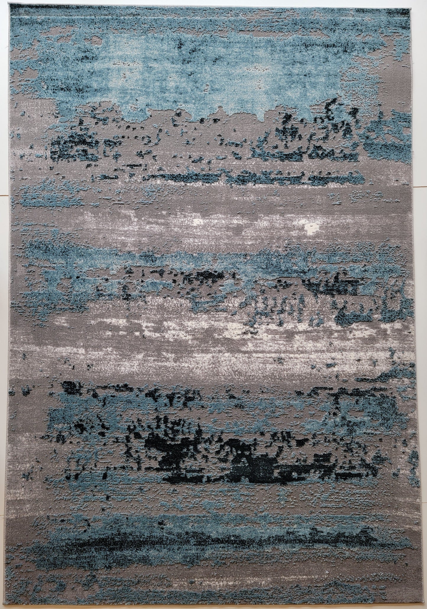 Thema Abstract Area Rug. Gray, Teal Blue, and White